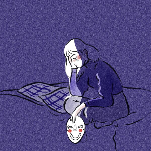 fille sur un lit qui pleure avec un masque dans la main